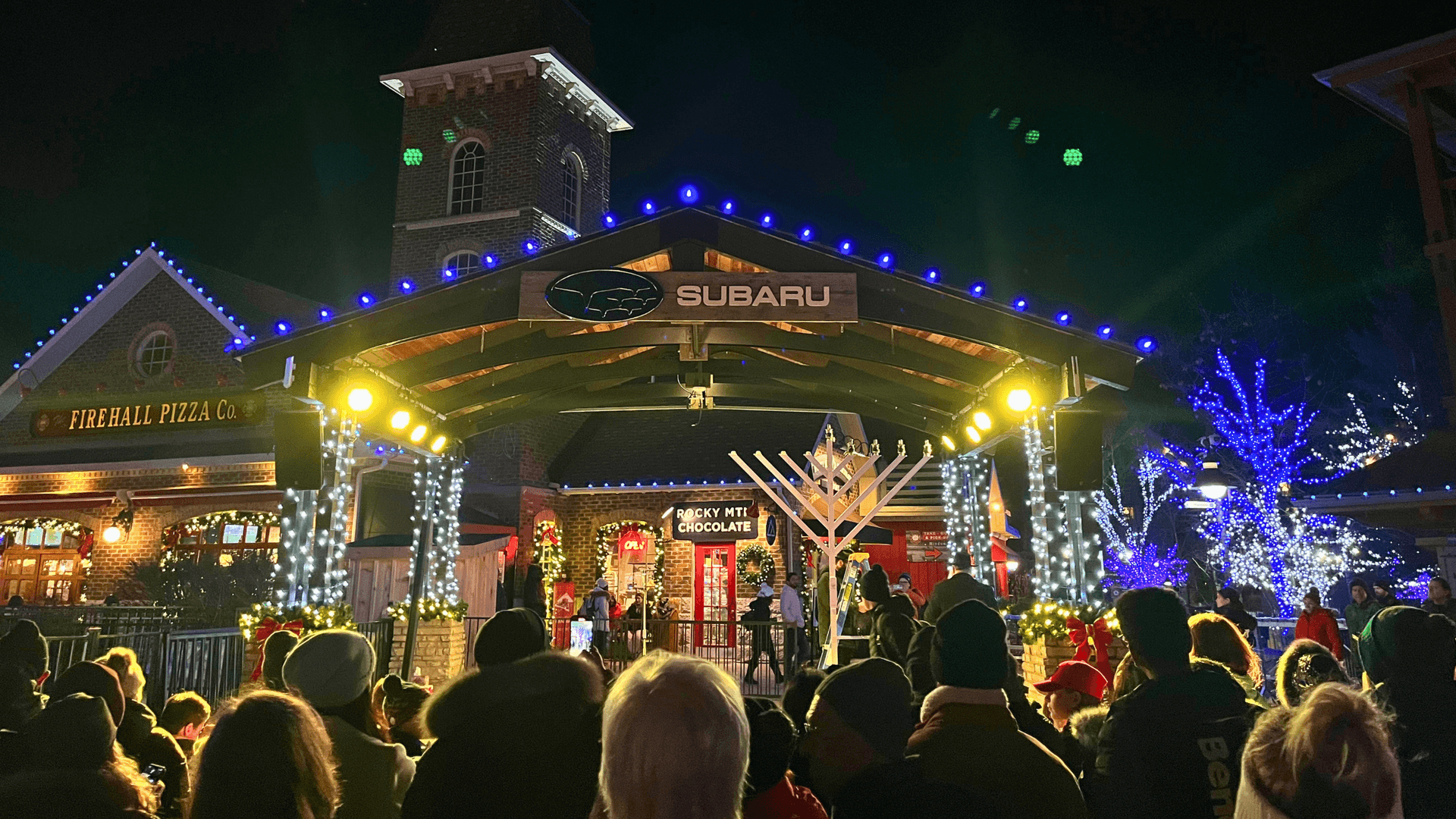 Families and friends gathered around the Subaru Stage for the Menorah Lighting Ceremony in the Events Plaza.